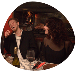 People Laughing next to the fire